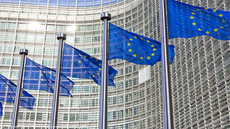 EU flags in front of the European Commission's Berlaymont building.