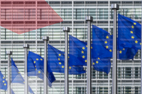 EU flags in front of the Berlaymont Building in Brussels.