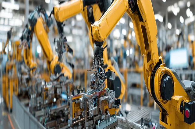 Robotic arms at an automated assembly line.
