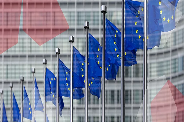 EU flags in front of the "Berlaymont" building in Brussels.