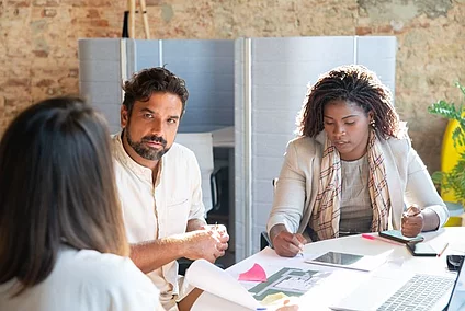 A group of people discussing.