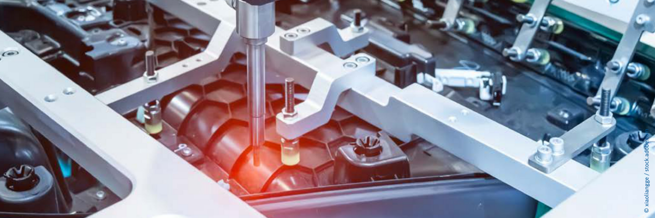 Robotic arm at an assembly line