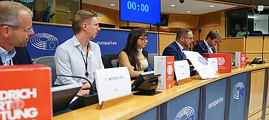 A side view of the panelists