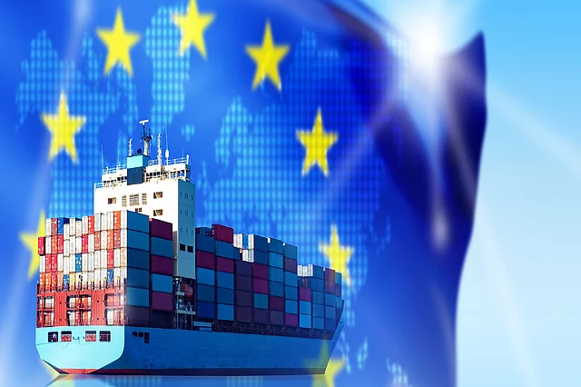 A cargo ship with an EU flag in the background.
