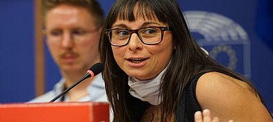 Study author Cecilia Rikap speaks into a microphone