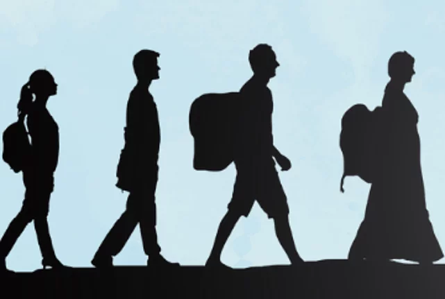 Shadows of a diverse group of people (women, men, children) with backpacks and luggage walking against a blue sky.