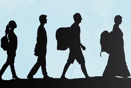 Shadows of a diverse group of people (women, men, children) with backpacks and luggage walking against a blue sky.